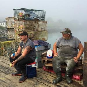 “Working Maine,” the current show at the Maine Art Gallery in Wiscasset, includes this photo by Gina Mazza that captures lobstermen taking a break.