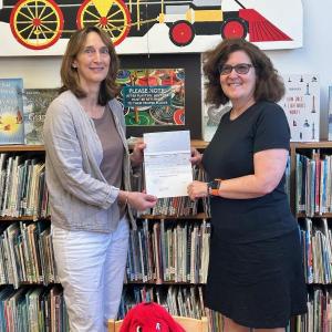 Julie Casson, right, Community Digital Planner, Coastal Maine Regional Broadband presents a check to Southport Memorial Library Director Jen Britton. Courtesy photo