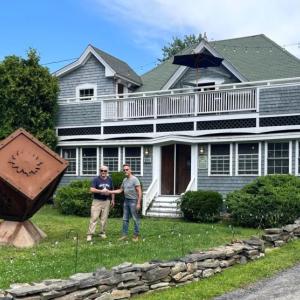 Boothbay Region Sculpture Trail board member Bill Royall with artist Rob Lash post-installation at Carriage House Restaurant. Courtesy of Bill Royall