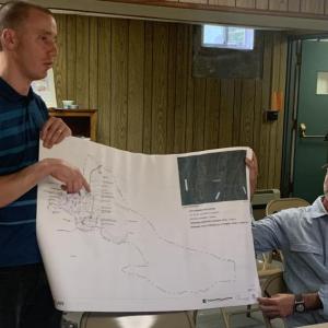 Knickerbocker Group design studio leader Julien Jalbert, left, explains his clients’ plans Aug. 10 to build a honeymoon cottage at their Cross Point Road location. BILL PEARSON/Boothbay Register