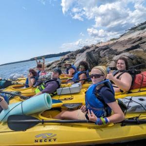 Local teens get off the grid for a kayak trip to Hog Island. Courtesy of Hearty Roots