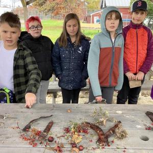 Dalton Wyman, Hope Valier, Amesley Franssen, Charlie Herrick and Finn Ferriera check out the seed collection. Becky Hallowell photo