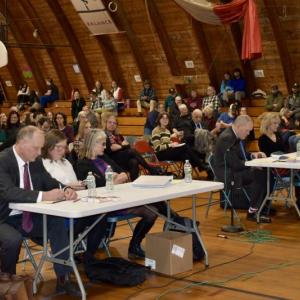 Wiscasset Superintendent of Schools Kim Andersson, second from left, and, at other table, WMHS Principal-on leave Gina Stevens, Dec. 20 at the hearing in the WES gym. PHIL DI VECE/Wiscasset Newspaper