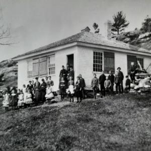 An image from “Currents, Courses & Streams, Alna, Maine” shows students outside Alna- Newcastle School. Courtesy of the Alna Archives