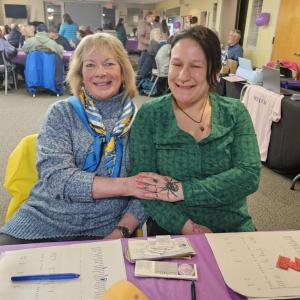 Canny Chan, left, and Chantel Nelson sell dinner tickets and accept donations at the Feb. 28 fundraiser in Wiscasset, in support of Willow Orr. Beth Bluteau photo