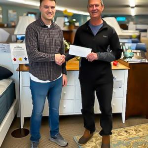 Wilmot Dow, left, GM at Dow Furniture, and Robert Clifford, secretary for the Community Energy Fund. Courtesy photo