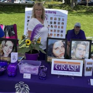Parents who lost loved ones to overdose staff a resource table at a 2023 716 Candles International Overdose Awareness Day event in Damariscotta. Courtesy of Peter Bruun