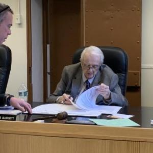Chief Deputy Rand Maker, left, seeks Commissioners William Blodgett’s and Hamilton Meserve’s, right, signatures on animal control officers’ contracts for Dresden, Bremen, Nobleboro, Westport Island and Waldoboro March 19. BILL PEARSON/Boothbay Register