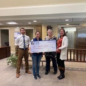 Pictured from left are: First National Bank’s Samuel Jackson, Help Yourself Shelf Food Pantry’s Gabrielle Diperri, and First National Bank’s Jean Moffatt and Monique McRae presenting Help Yourself Shelf with a check for $500. Courtesy of FNB