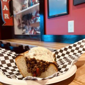 Pier 1 Pizza shaves and marinates its steak in-house. This sandwich comes with American cheese, red and green peppers, red onion, mushrooms and mayo. Courtesy of Pier 1 Pizza
