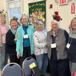 From left, Garden club members Lisa Freeman, Jan Flowers, Sally Gemmill, Brenda Lacombe, Robin Grant and Canny Cahn wear fascinators they created for April’s flower design class “Fascinator Fashion.” Terry Heller photo