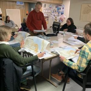 Chris Sieracki, standing, shows the Edgecomb Planning Board plans April 12 for a new home on Cross Point Road. BILL PEARSON/Boothbay Register