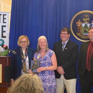 Gov. Janet Mills, far left, with Wiscasset Elementary School’s Becky Hallowell as Hallowell was named Lincoln County teacher of the year May 9. Kim Andersson photo
