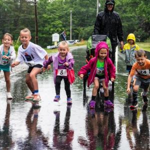 Unfazed by the rain, a group of younger runners start off at a sprint during the kids’ leg of the Edgecomb 250th Birthday Road Race on June 22. The family friendly event catered to all ages and several racers even walked or ran the course with strollers. Bisi Cameron Yee photo