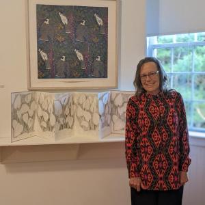 Artist Rebecca Goodale with “Gray Jays” and “Calla palustris.” CANDI JONETH/Boothbay Register