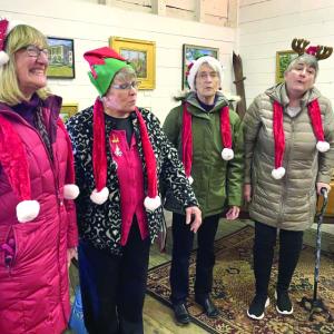 the Heart ‘n Soul Quartet bring the songs of the season to Wiscasset Village during Wiscasset Holiday Marketfest. Lucia Droby photo