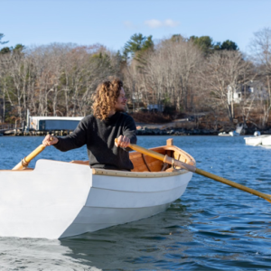 Matthew Dirr, Boat Shop instructor, takes to the water with the new Lawton Dory. Courtesy photo Matthew Dirr