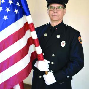 Woolwich first responder Frank Petrulli posts the colors. PHIL DI VECE/Wiscasset Newspaper