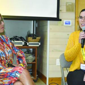 Patrisha McLean listens to Rebekah's final remarks at the Bosarge Education Center at CMBG as part of the Finding Our Voices Let's Talk About It event Sept. 11. LISA KRISTOFF/Boothbay Register