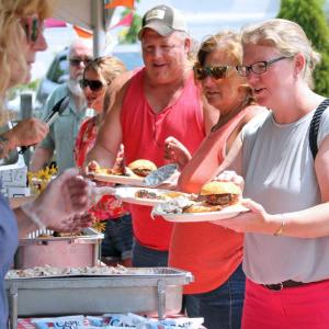 Filling the plates at the Boothbay Harbor First Department barbecue. STEVE EDWARDS/Boothbay Register
