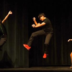 Scout Martin, Collin Cantillo, and Kyleigh Cole bell kick at the end of their performance of "Fame & Fortune" from Rudolph. 