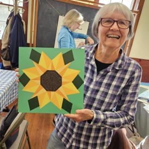 Rita Arnold and her sunflower. Courtesy of Saskia Reinholt