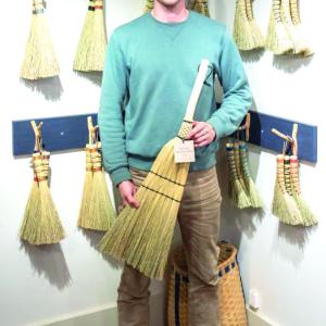 Holding a broom 
