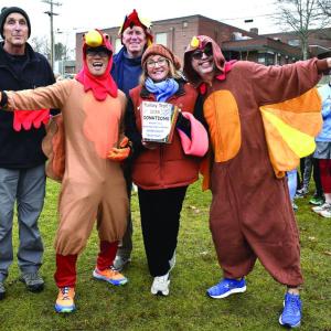 Volunteers and runners spread Thanksgiving cheer before the start of the 2024 Boothbay Region Turkey Trot. FRITZ FREUDENBERGER/Boothbay Register