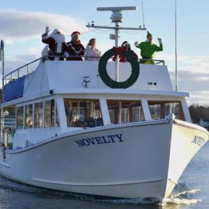 Santa and his entourage arriving by boat to Whale Park Dec. 7. FRITZ FREUDENBERGER/Boothbay Register