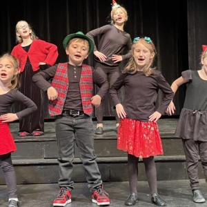 Front row: Cora Tindal, Oscar Mirabile, Josie Roy, Jackie Cronk; back row: Finley Piercy, and Kaylee Wayda perform in "We Are Santa's Elves".  