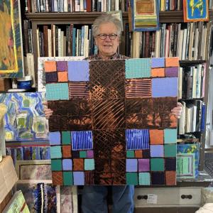 Artist John Seitzer and one of the new paintings being created in studio this winter. LISA KRISTOFF/Boothbay Register John Seitzer painting