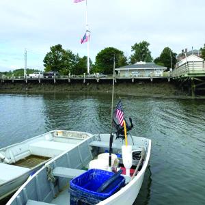 The wind keeps a small American flag and a big one moving Sept. 7 on the Wiscasset waterfront. SUSAN JOHNS/Wiscasset Newspaper 
