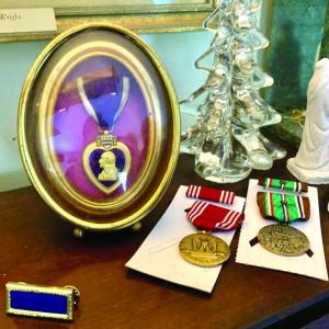 The original 1944 Purple Heart and some of the new medals awarded posthumously to Elmer Wright for his service in WWII. ISABELLE CURTIS/Boothbay Register