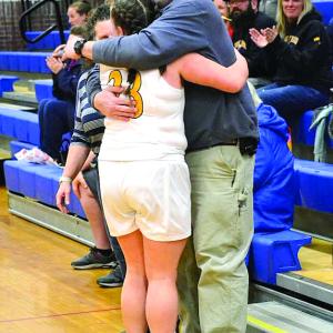 Seahawks senior Margret "Meg" Sledge gets a hug from her father, Matt Sledge, during Senior Night. KEVIN BURNHAM/Boothbay Register