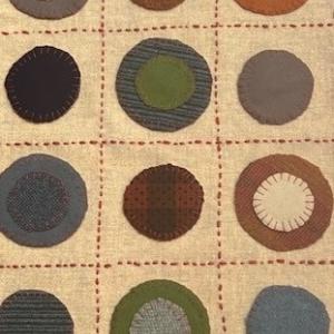 Textile with circles: Donna Strawser's "Big Coin Penny Rug Table Runner." Courtesy of River Arts