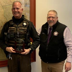 Jeff Rogers, left, receives congratulations from Sheriff Todd Brackett Feb. 18 after being named Lincoln County Deputy of the Year. BILL PEARSON/Boothbay Register Deputy of Year