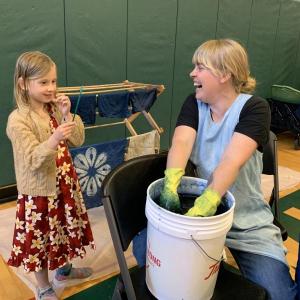 Indigo Sanders-Stoyle, then 7, of Wiscasset watches artist Emily Bell-Hoerth dip and dye in indigo at Wiscasset’s 2024 Earth Day celebration at Wiscasset Community Center. File photo 