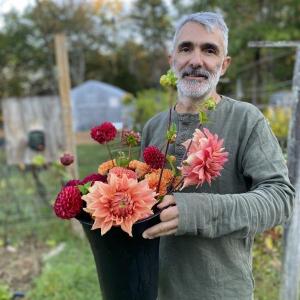 Alain Ollier with dahlias. Courtesy of Veggies to Table