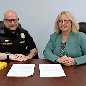 Boothbay Harbor Police Chief Doug Snyder and State Rep. Holly Stover review their bill.  JANE CARPENTER/Boothbay Register