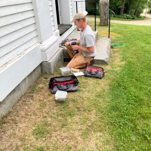 Darryn Petersen restores plinths to Head Tide Church in Alna. Courtesy photo Restoring