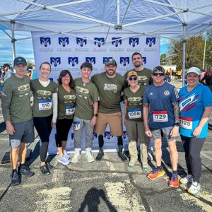 The Dow Furniture Team at the Miles for Mills 5K from left: Wilmot Dow, Elise Wallace, Lisa Dow, David Kolarik, Travis Mills, Rebecca Norton, Matthew Norton, Randy Joubert, Rebecca Wylie. Courtesy of Matt Norton