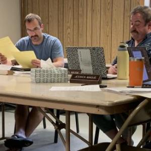 New selectman Forrest Carver, second from left, explains the municipal warrant figures to his colleagues June 10 during the board meeting. BILL PEARSON/Boothbay Register Forrest Warant