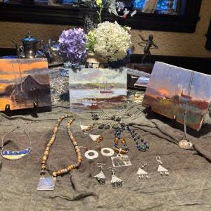 A sample of the art and jewelry in the Kathleen Billis and Jennifer Matthews show at Calypso opening Sept. 5 in Boothbay Harbor. LISA KRISTOFF/Boothbay Register Art by Kathleen Billis; Jewelry by Jennifer Matthews.