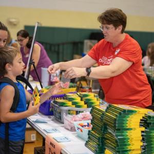 Wiscasset Elementary School Assistant Principal Danielle Harris hands out school supplies to a Wiscasset family. Courtesy of Set for Success Courtesy of Set for Success