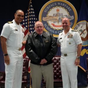 Capt. (ret) Floyston "Bud" Weeks, stands with Adm. Jim Kilby, Acting Chief of Naval Operations, and Capt. Joe Baggett, SWSC Commanding Officer, at his retirement ceremony at SWSC Newport, Naval Station Newport, R.I., July 18, 2025. John Goulette photo