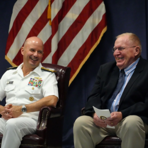 Capt. (ret) Floyston "Bud" Weeks, sits next to Adm. Jim Kilby, Acting Chief of Naval Operations, during his retirement ceremony at SWSC Newport, Naval Station Newport, R.I., July 18, 2025. John Goulette photo