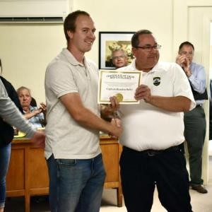 Shown are Woolwich Fire Capt. Brandon Bailey (c) along with Bath Deputy Fire Chief Chris Cummings (r) and Bath Fire Capt. Rick Davis (l). Bailey was recognized for valor and excellence at the scene of a recent fire. PHIL DI VECE/Wiscasset Newspaper