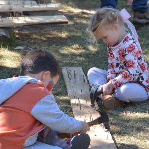 Pounding nails starts young. (Photo by Lynda Clancy)