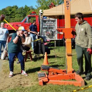 Unity Fire Department offers the chance to gong the bell with a show of strength and technique. (Photo by Lynda Clancy)