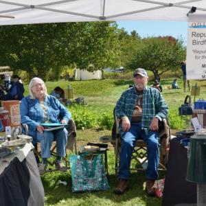 Queen and Dave Wacker, of Pittson, bring their repurposed bird feeders to the fair. They visit yard sales and the Goodwill stores to find suitable old coffee pots and tea kettles and refashion them into bird feeders. (Photo by Lynda Clancy)
